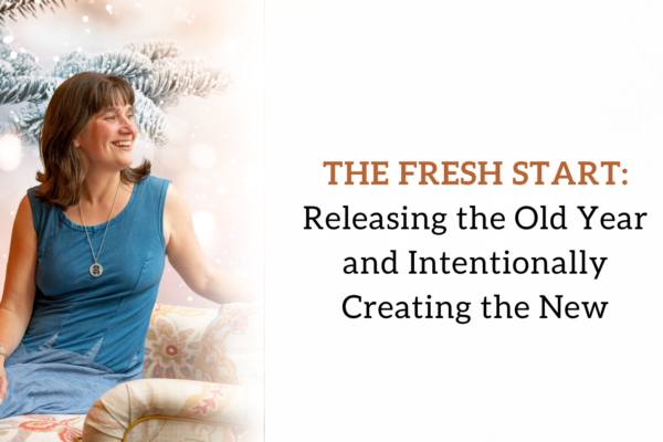 A joyful spiritual alignment coach in a blue dress with an enchanting smile, surrounded by a magical galaxy backdrop sparkling with stars and glittering light and with text The fresh start: Releasing the old year and intentionally creating the new